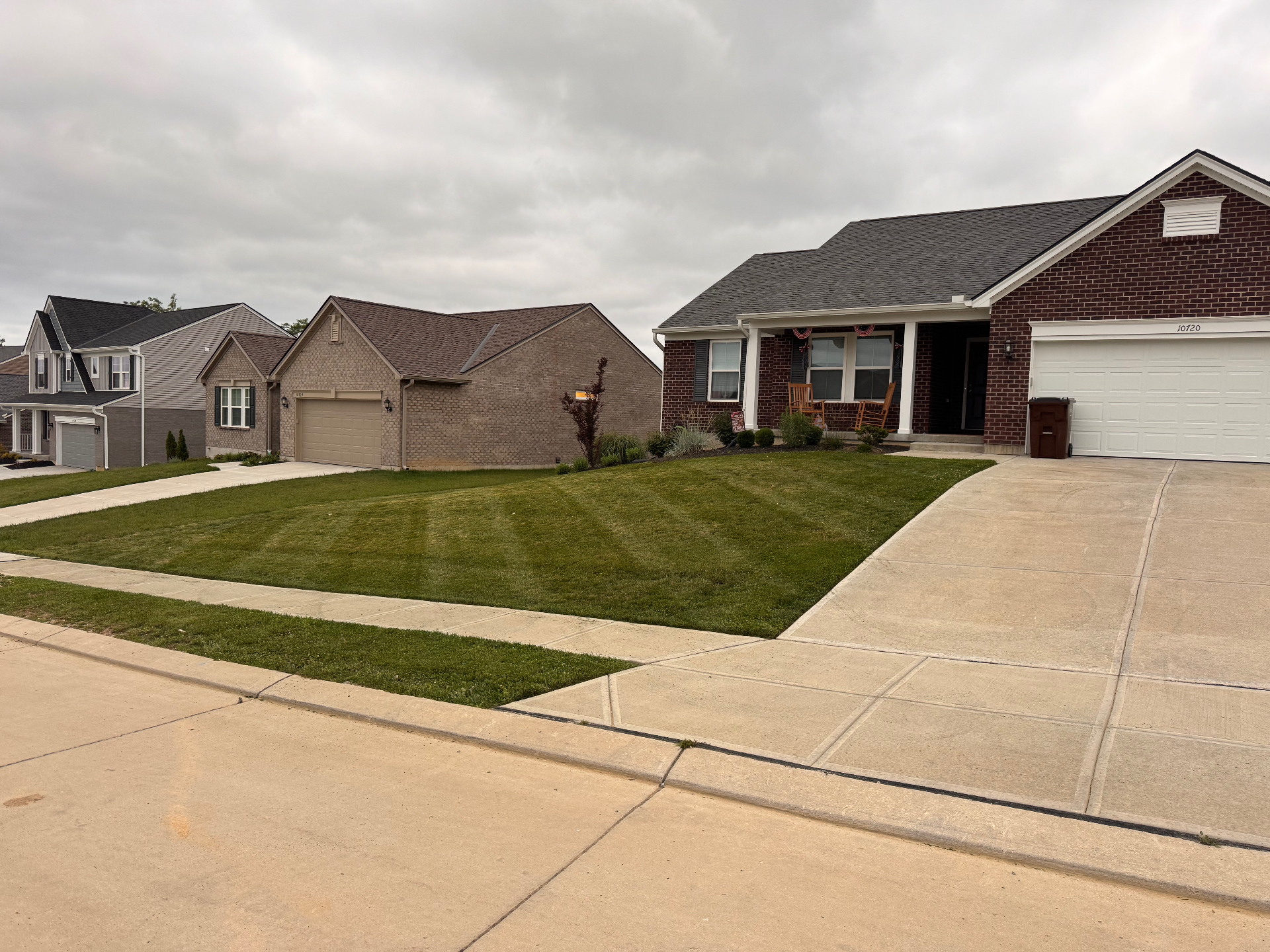 Manicured front yard with sharp edges along the driveway and sidewalk